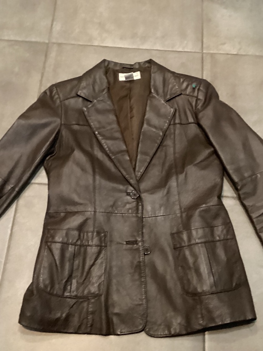 Newport News size 10 brown leather jacket. It has a boo-boo see description and